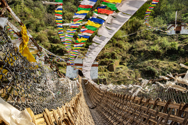 istock ancient holy bamboo bridge with many buddhist holy flags from unique perspective 1323280855