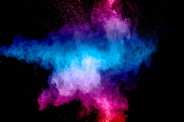istock Pink blue dust particles splash on black background.Pink blue powder splash. 1323283093