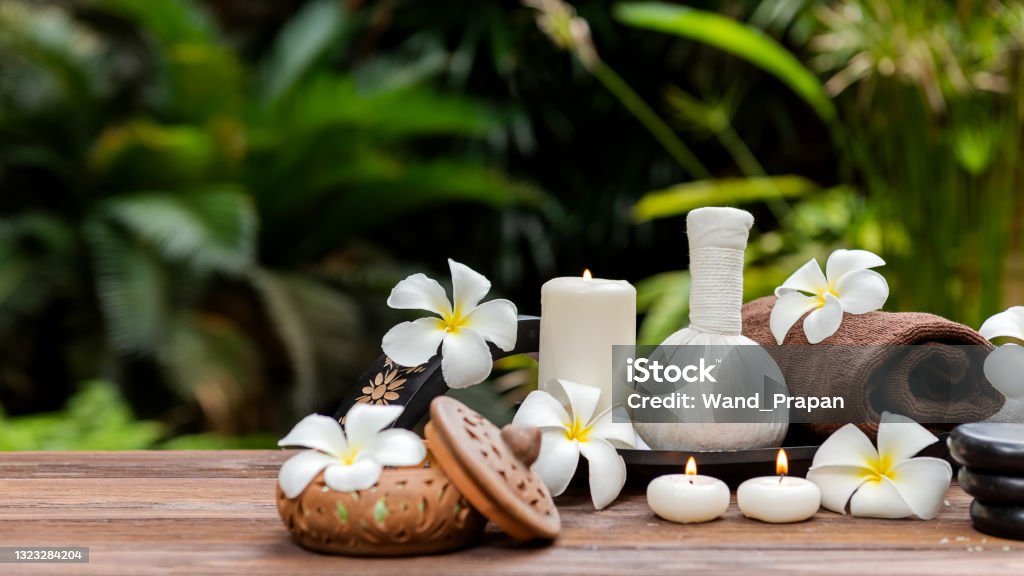 Thai Spa.  Massage spa treatment aroma for healthy wellness and relax. Spa Plumeria flower for body therapy.  Lifestyle Healthy Concept Candle Stock Photo
