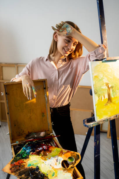 istock creative hobby hand painting tired smiling artist 1323288395