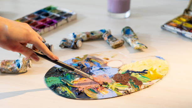 istock mixing colors art school creating artwork hobby 1323288572