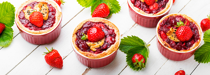 Delicious tartlets with berry jam.Cake with strawberries.