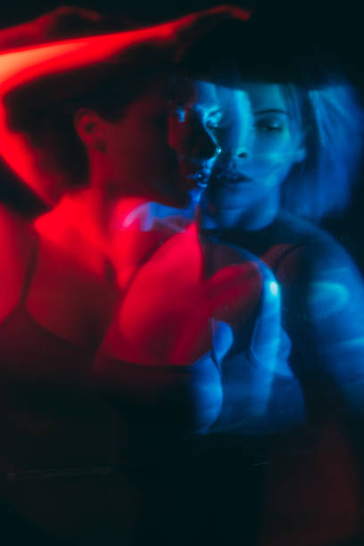 istock psychedelic hallucination woman in red blue light 1323295010