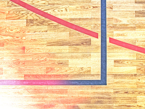 Painted lines and crosses. Wooden floor sports court.  Abstract.