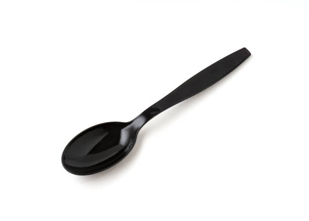 istock Black color plastic spoon isolated on white background. 1323299393