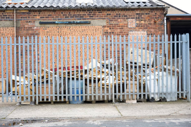 istock Cardboard and rubbish in waste compound for disposal at dump site 1323304309