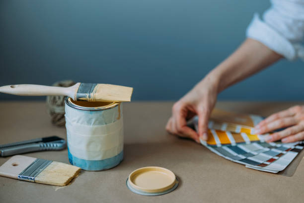 Close Up Of Woman Testing Yellow Paint