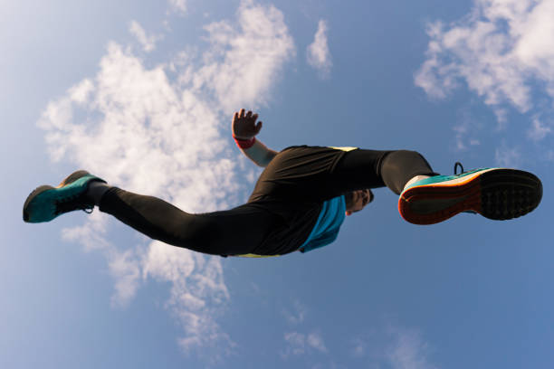 istock Sportsman runs and jump into the sky 1323306792