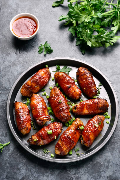 istock Bacon wrapped grilled chicken wings 1323311620