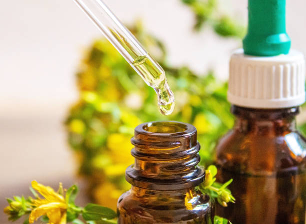 istock extract St. John's wort in a small jar. Selective focus. 1323313316