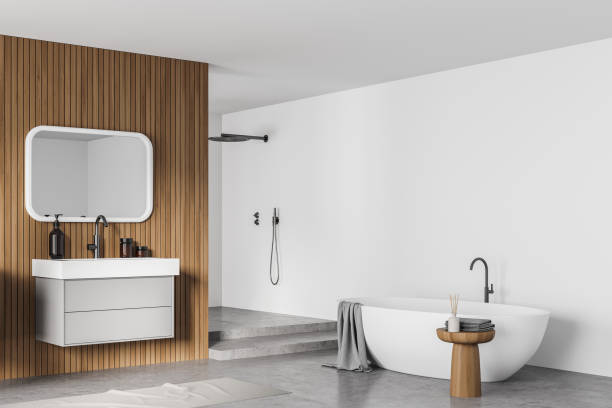 istock Bathtub and sink with mirror in white bathroom interior with shower 1323313545
