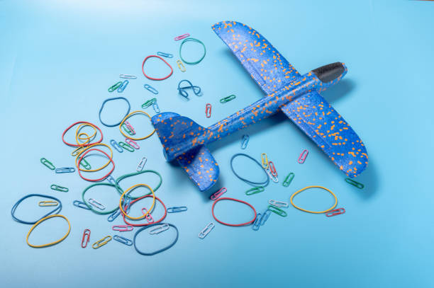 istock Flying plane. Toy plane and colorful circles. Departing plane. 1323314257