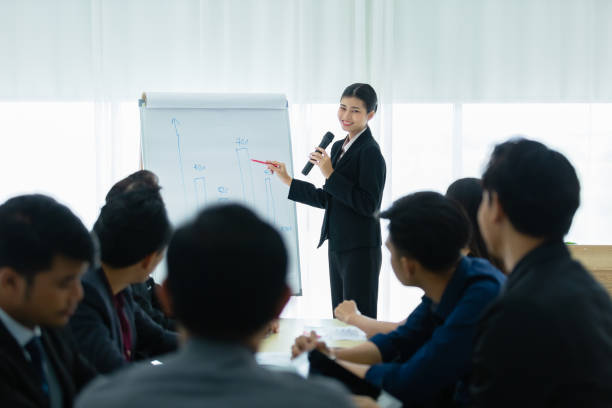 istock Leader talking with whiteboard presentation seminar corporate in meeting room, training business person. 1323315642