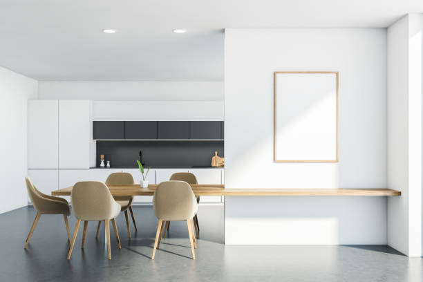 istock White kitchen interior with table and chairs near window, mockup poster 1323315648