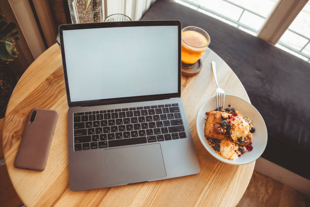 istock the laptop in cafe on the table with white screen in cafe 1323317182