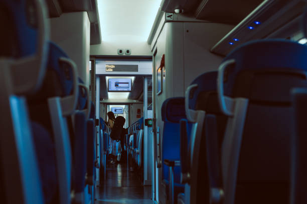 istock interior of the train wagon with passenger in the background 1323319152