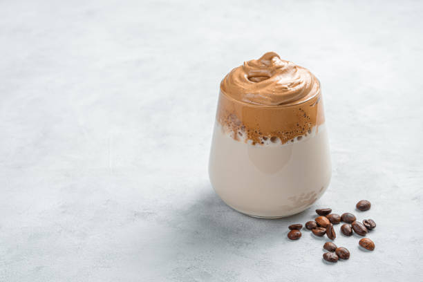 istock Dalgona coffee and coffee beans on a gray background 1323320463