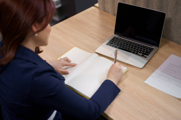 istock Woman working with papers in her office 1323320574