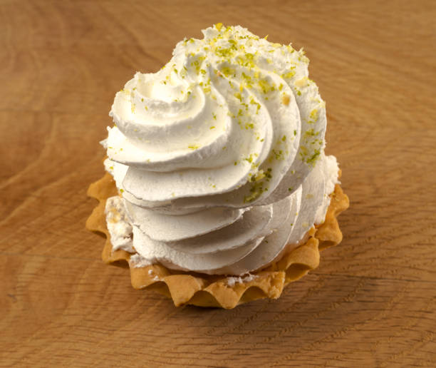 istock Cake, confection, based on protein cream, on a wooden board 1323323068