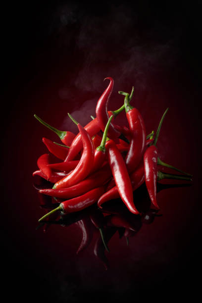 istock Red hot chili pepper on a black background. 1323323389