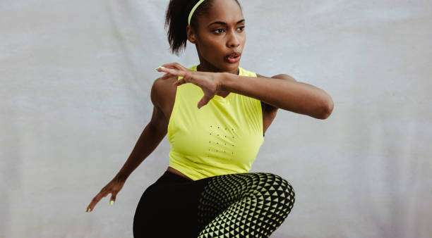 istock African woman with fit body doing workout 1323325796