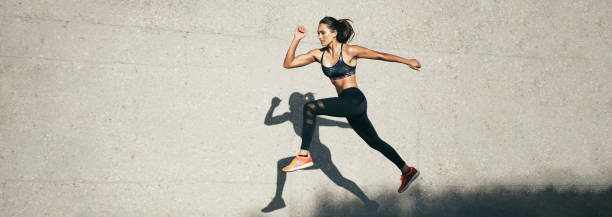 istock Fit woman jumping and running 1323326860