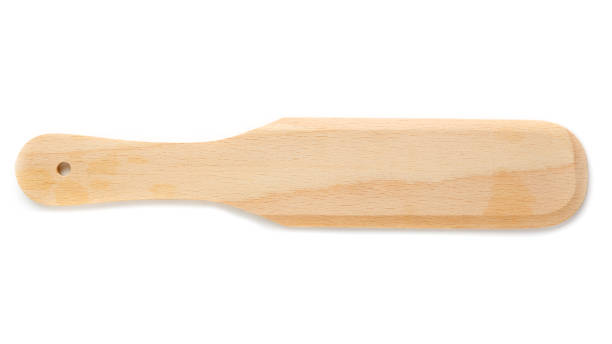 istock Simple wooden spatulas, kitchen tool, close-up, isolated on white background 1323328089
