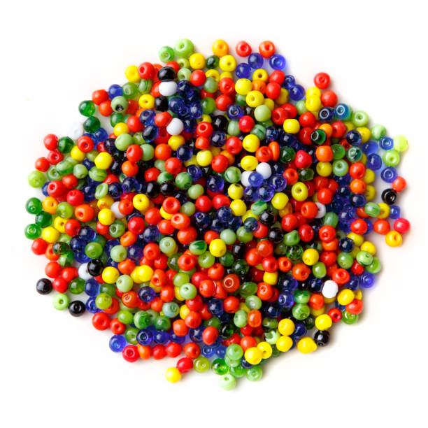 istock lots of small, multi-colored glass beads, isolated on a white background 1323328092