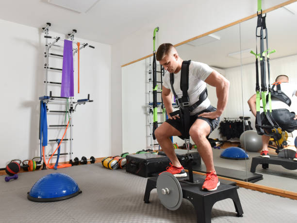 istock Handsome male working out in gym 1323328319