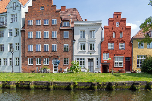 Lübeck, Germany, June 2021: Beautiful houses at the banks of Trave River