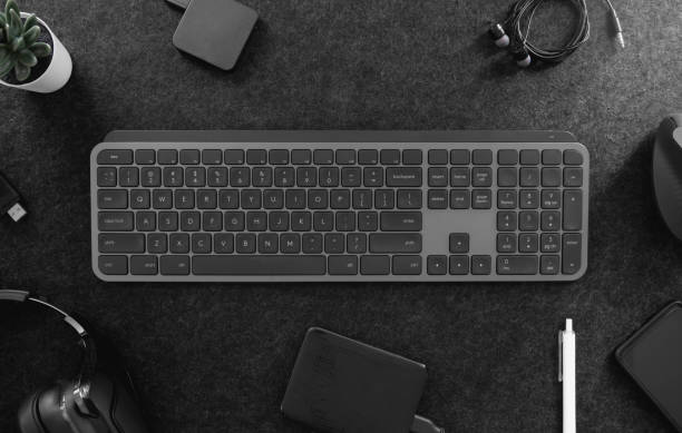 istock top view of office desk table with keyboard, mouse, smartphone and accessory on table. 1323331481