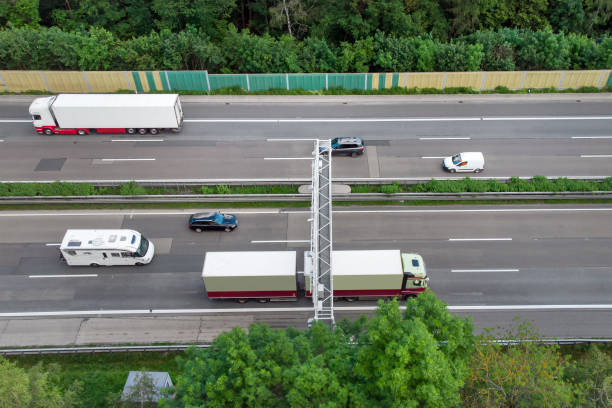 istock Truck toll system on highway - control gantry, aerial view 1323332694