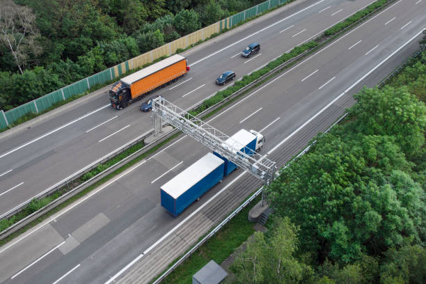 istock Truck toll system on highway - control gantry, aerial view 1323332785