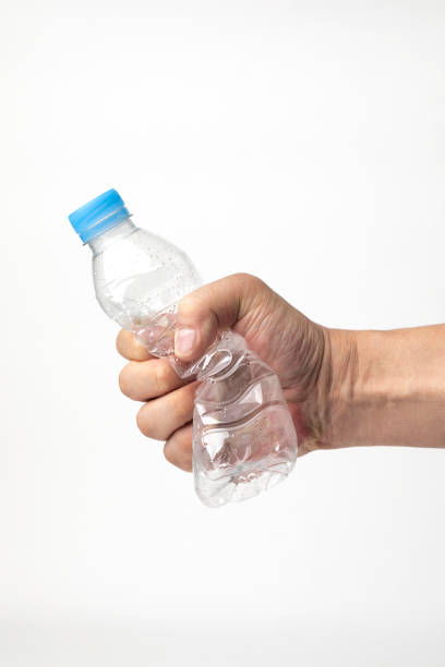 istock male hand holding water bottle 1323338951
