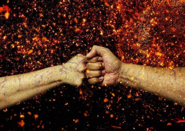 istock Collision fist and flame background 1323339943