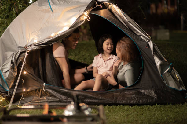 istock Asian Chinese family playing bonding inside camping tent at backyard 1323343863