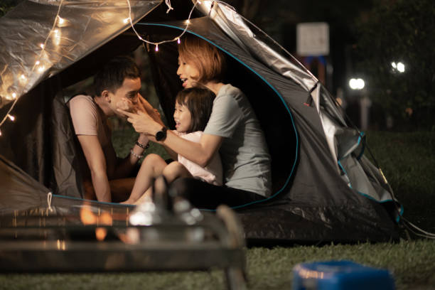 istock Asian Chinese family playing bonding inside camping tent at backyard 1323343872