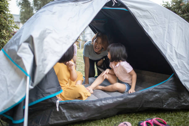 istock Asian Chinese family playing have fun inside camping tent at backyard 1323343948