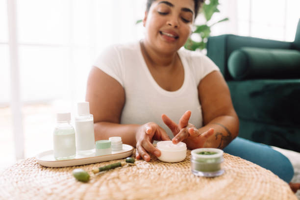 istock Woman using skin care cream 1323344123
