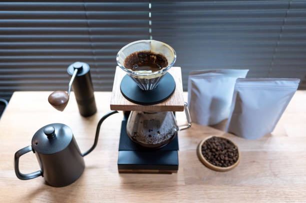 istock Hand drip coffee, Barista making drip coffee with mockup blank package coffee Alternative ways of brewing Coffee shop concept. 1323350138