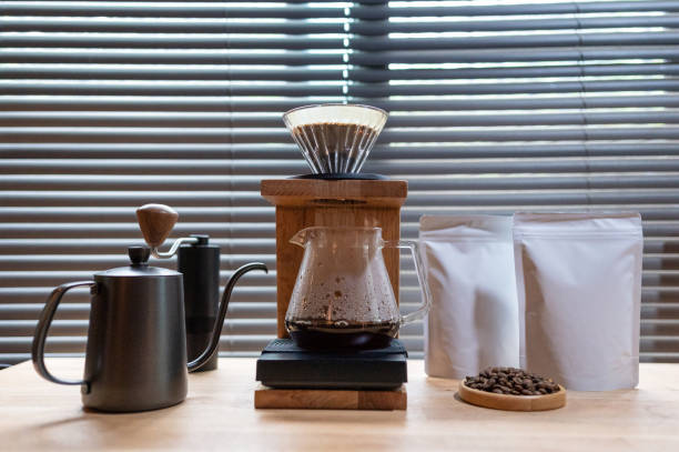 istock Hand drip coffee, Barista making drip coffee with mockup blank package coffee Alternative ways of brewing Coffee shop concept. 1323350169