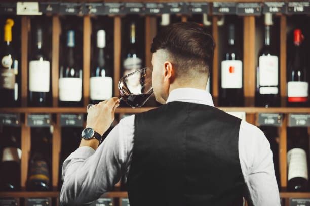 istock Male sommelier tasting red wine at cellar. 1323350827