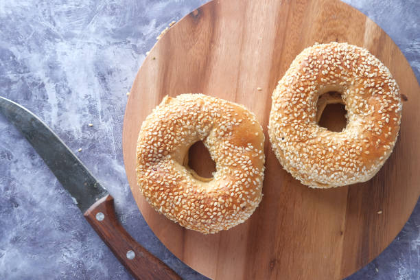 istock fresh bagel bread in a paper on table 1323352076