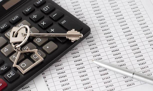 istock Home key on calculator with chart and pen 1323355765