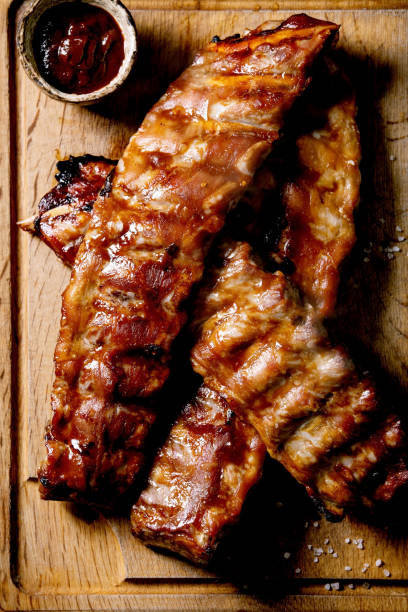 istock Grilled pork ribs on wooden plate 1323356015