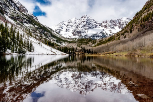 istock Maroon Bells reflection with bad weather moving in 1323357790