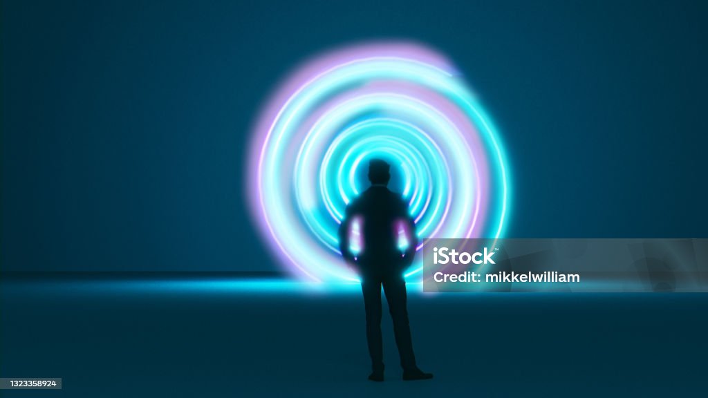 Man stands in front of a vortex or time machine with a spiral pattern Colorful portal or vortex with a spiral pattern. Man stands in front of it undecided. Maybe it is a time machine. The Way Forward Stock Photo
