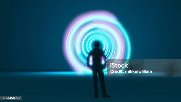 Man Stands In Front Of A Vortex Or Time Machine With A Spiral Pattern Stock Photo - Download Image Now