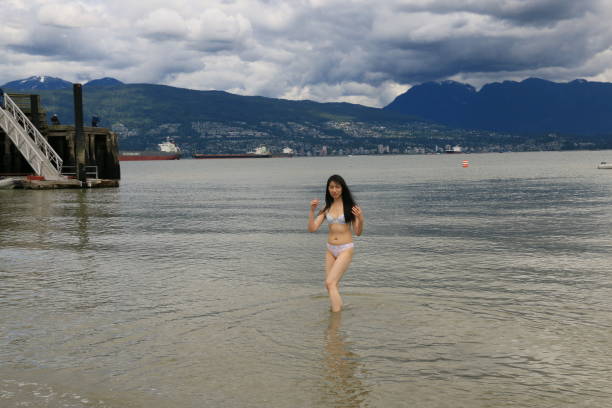 istock Wading Out of the Sea 1323361568