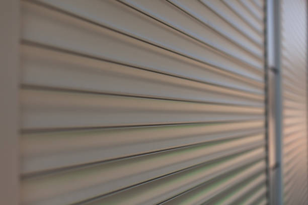 The surface of the blinds on the shop windows. Refracted plastic surface. stock photo